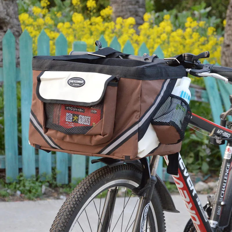 Pet bicycle carrier in Oxford material for small cats and dogs, attached to handlebars with traction hook visible