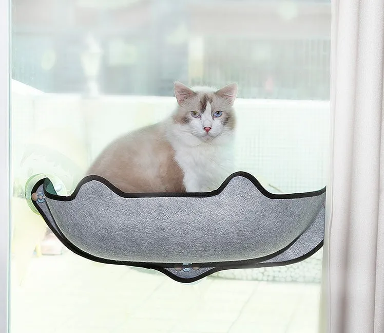 Cat sleeping on a window sill hammock made of EVA and felt cloth, secured by three 8.5cm suction cups