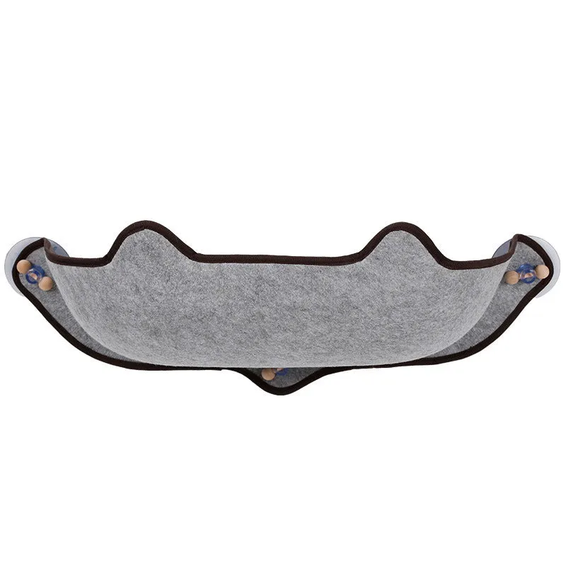 Cat sleeping on a window sill hammock made of EVA and felt cloth, secured by three 8.5cm suction cups