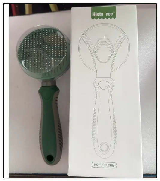 Automatic hair removal comb in green with stainless steel coarse needles, plastic and TPR body on white background