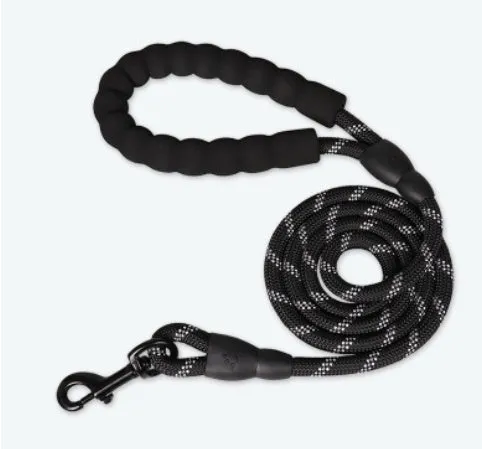 Reflective nylon dog leash in fluorescent green on a black background, showing reflective stripes along the lead.