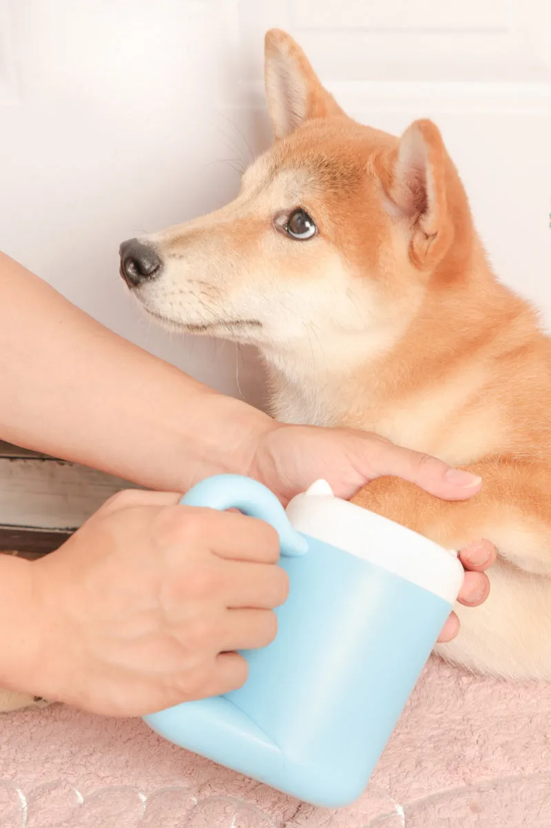 Pink pet paw cleaning cup with silicone brush and handle