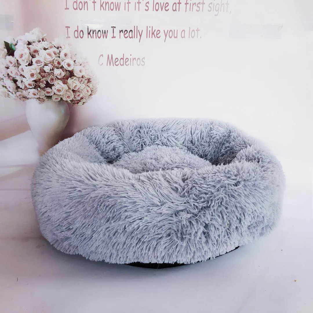 Plush pet nest in apricot colour on floor, soft cloth circular dog bed 40cm diameter indoor use