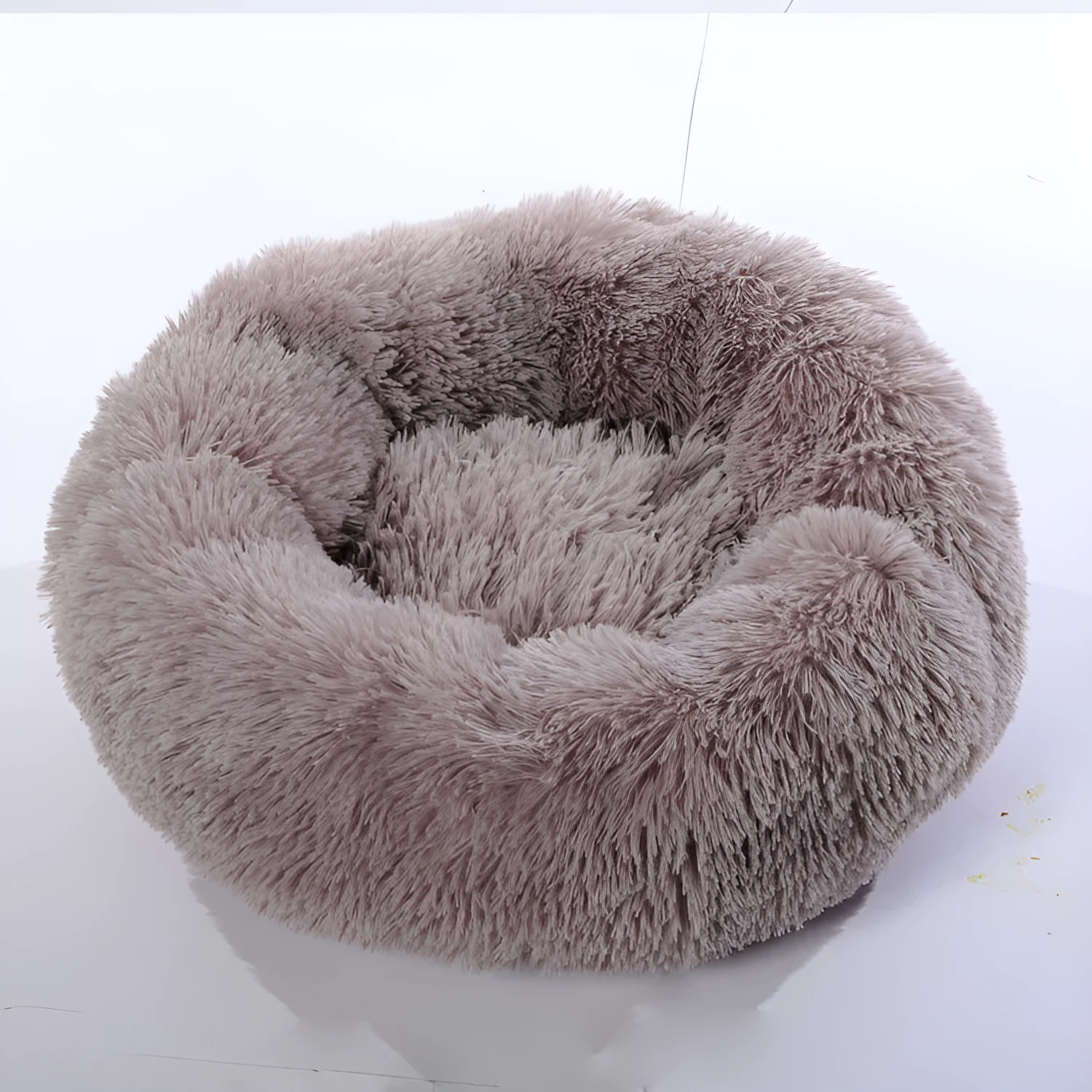 Plush pet nest in apricot colour on floor, soft cloth circular dog bed 40cm diameter indoor use