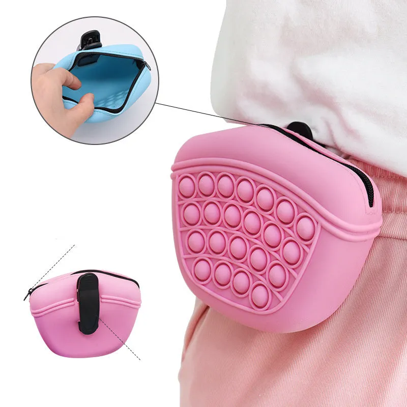 Blue silicone dog training treat pouch with magnetic closure and waist clip on a belt