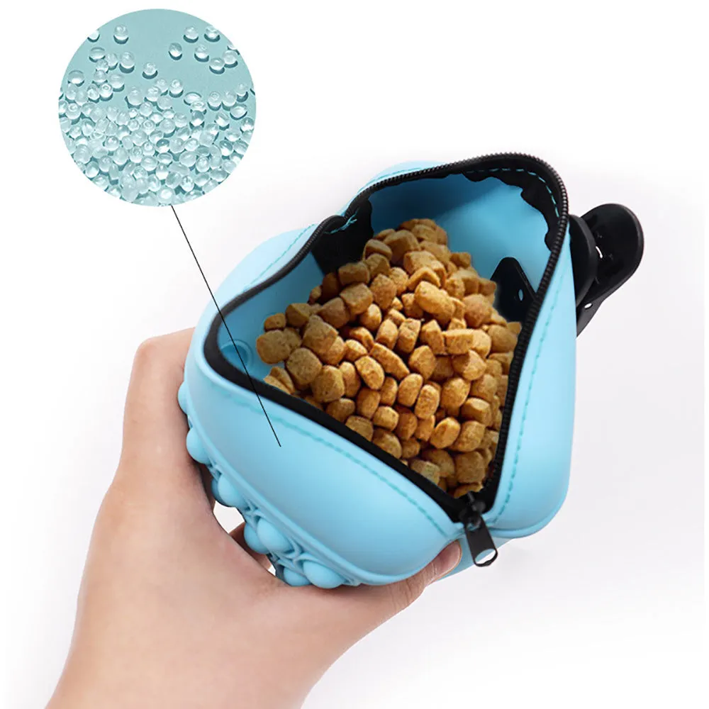 Blue silicone dog training treat pouch with magnetic closure and waist clip on a belt