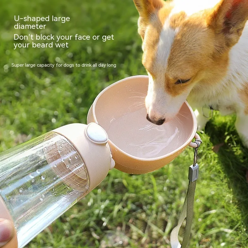 Portable dog water bottle and food container in yellow with attached bowl for outdoor pet hydration