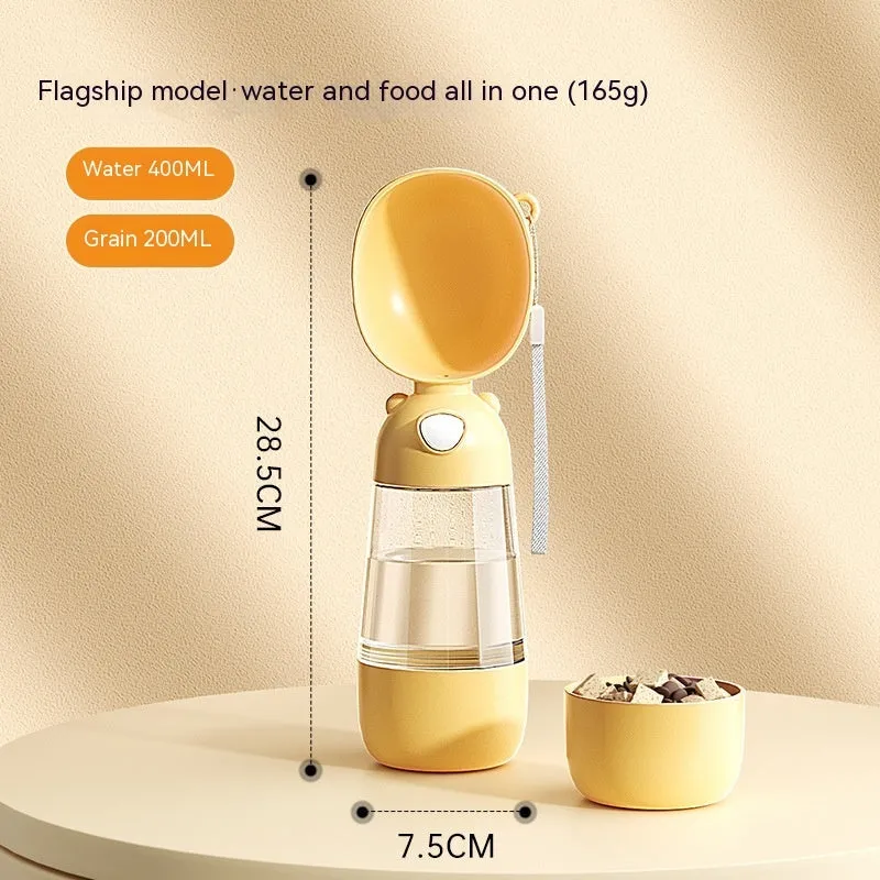 Portable dog water bottle and food container in yellow with attached bowl for outdoor pet hydration
