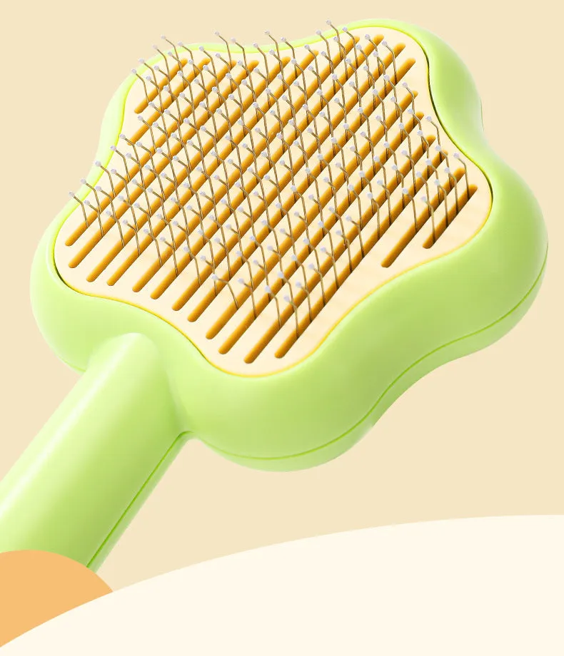 Self-cleaning stainless steel pet comb with green handle, showing the 20cm length and needle teeth