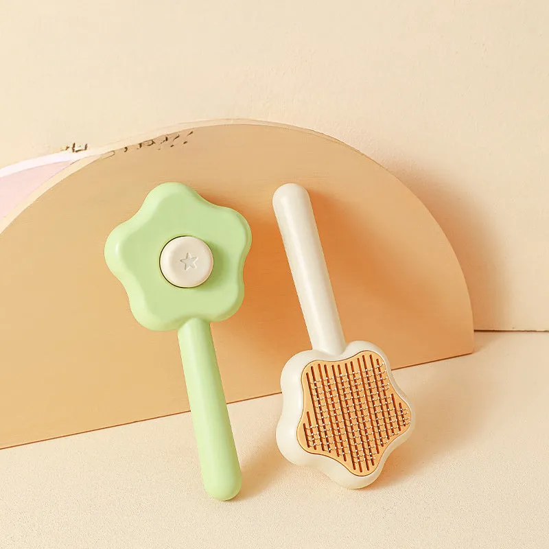 Self-cleaning stainless steel pet comb with green handle, showing the 20cm length and needle teeth