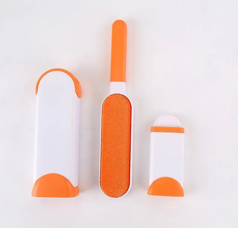 Reusable cat dog hair removal comb with self-cleaning base, double-sided extra-large lint brush on a sofa