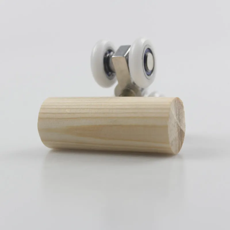 Small rollerskate-shaped bird puzzle toy made of pine and metal measuring 50x20x21mm