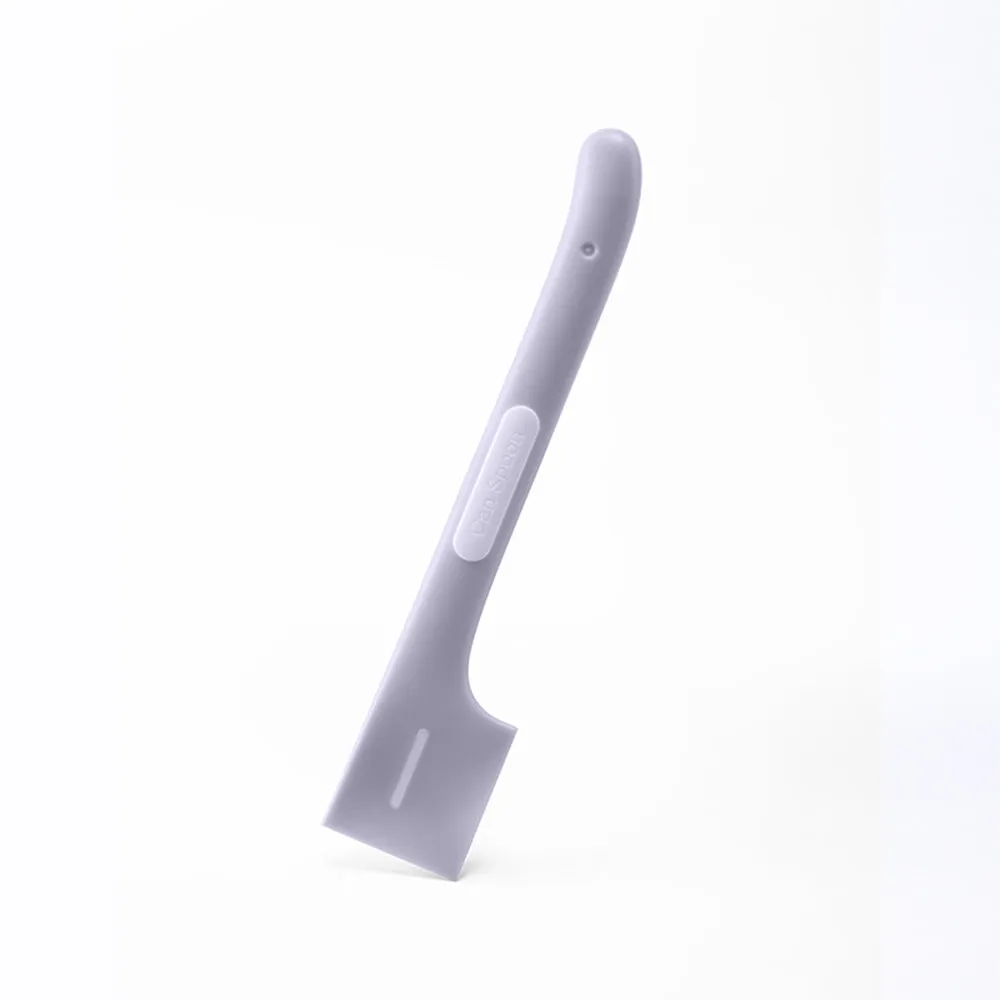 Green long-handled pet food spoon with angled head for scooping canned cat or dog food.