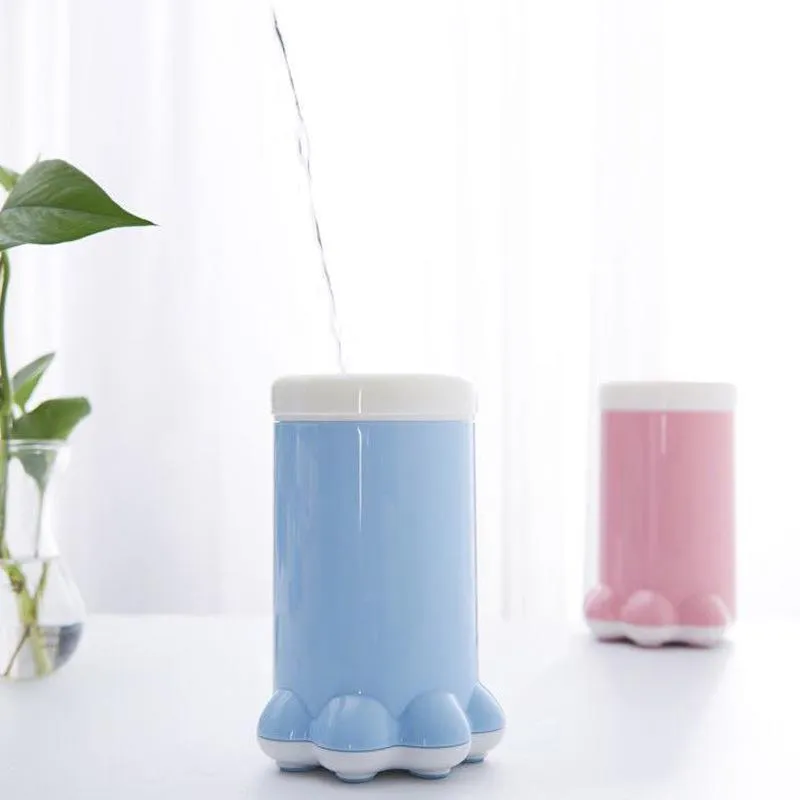 Pet paw washer cup in pink and blue silicone with PP plastic body, 11cm diameter by 17cm tall
