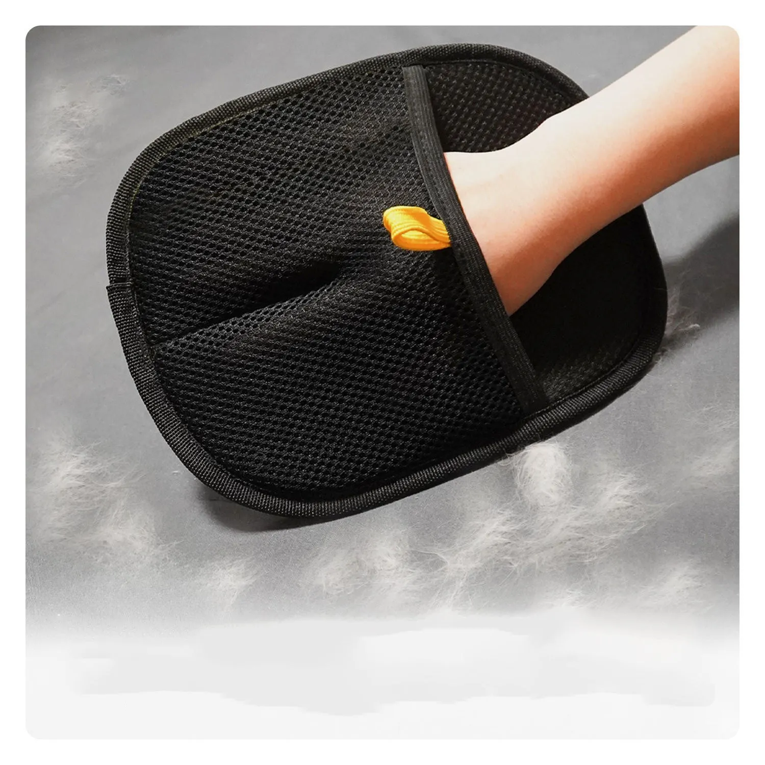 Pet electrostatic hair removal gloves with two-way bristles on a light background