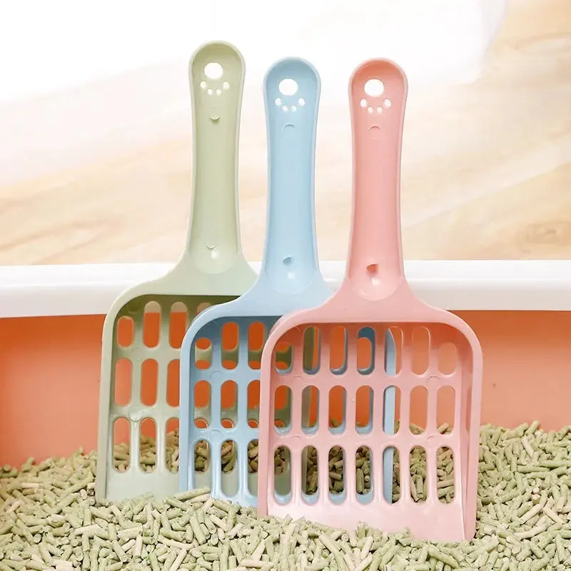 Plastic cat litter scoop in blue, green or pink colours showing 20cm length