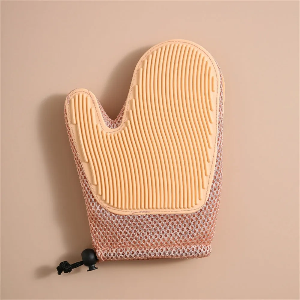 Dark blue pet hair removal glove for cats and dogs on a fabric background