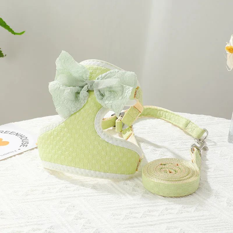 Small puppy hand-held rope chest strap in beige cloth on a wooden floor