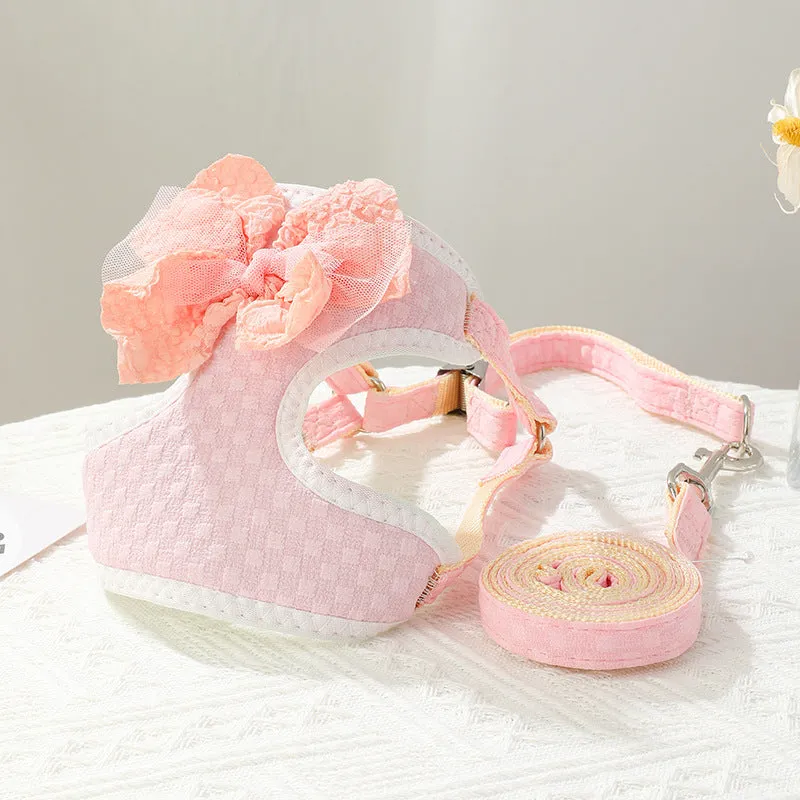 Small puppy hand-held rope chest strap in beige cloth on a wooden floor