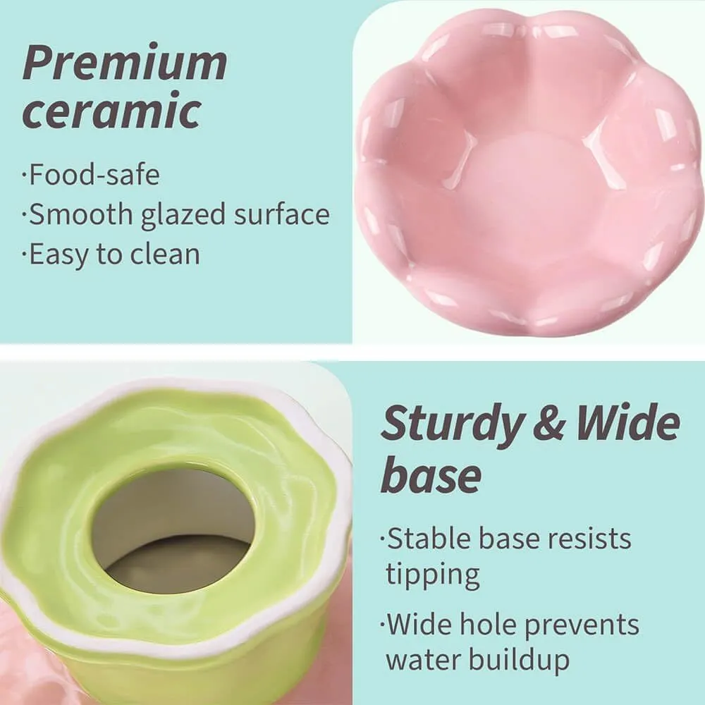 Pink ceramic raised cat bowl with wide shallow design, slanted angle, and flower shape on non-slip base