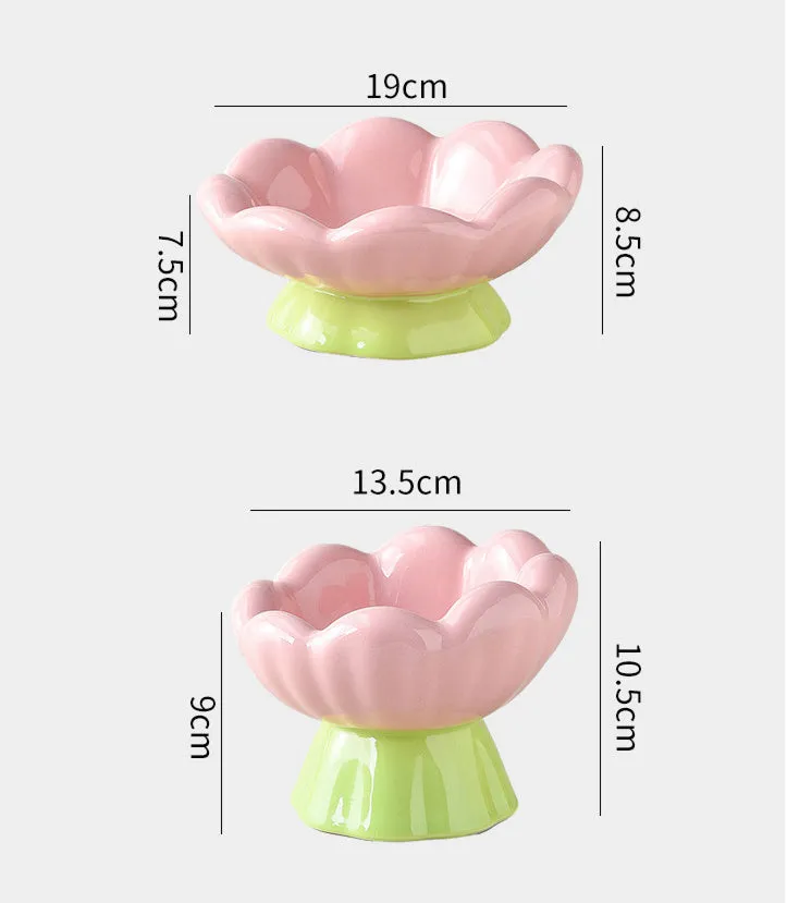 Pink ceramic raised cat bowl with wide shallow design, slanted angle, and flower shape on non-slip base