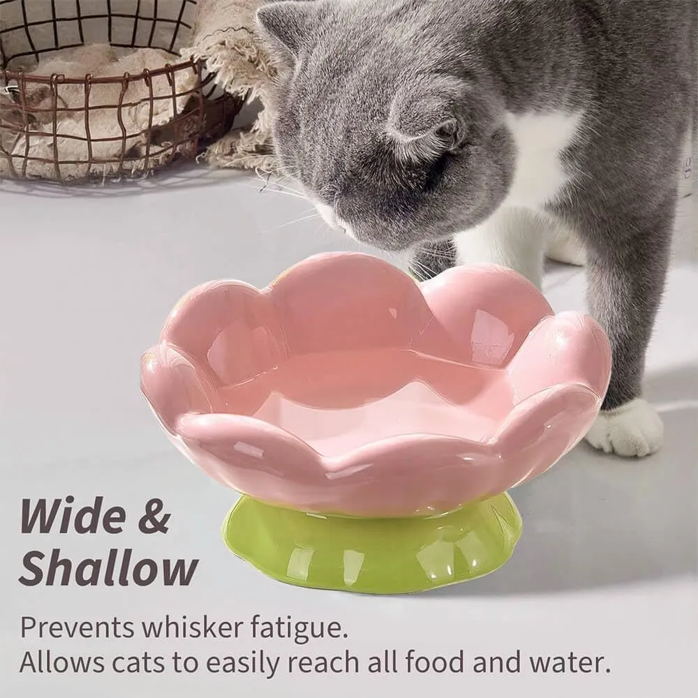 Pink ceramic raised cat bowl with wide shallow design, slanted angle, and flower shape on non-slip base