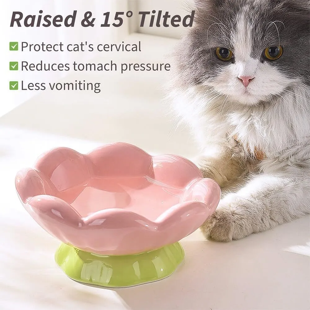 Pink ceramic raised cat bowl with wide shallow design, slanted angle, and flower shape on non-slip base