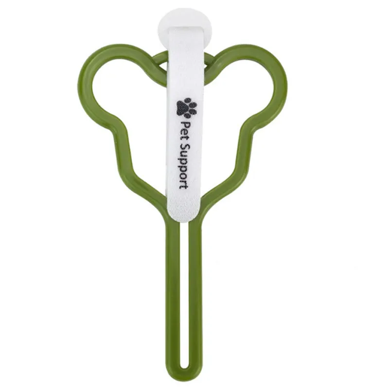 A hands-free dog poop bag holder with a fixed metal clip and a black Velcro strap for leash attachment.