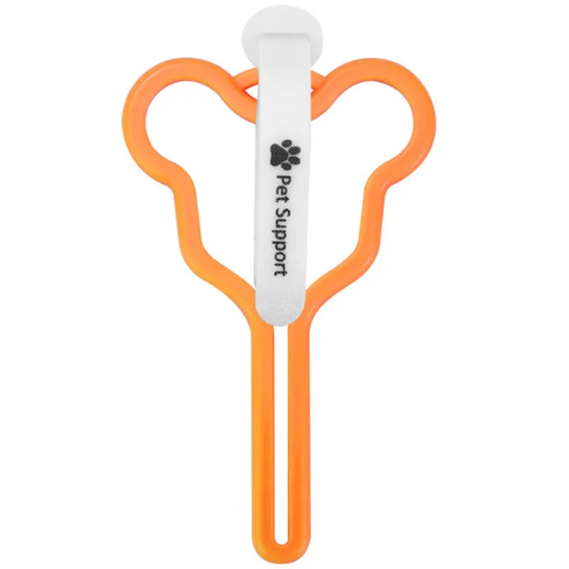 A hands-free dog poop bag holder with a fixed metal clip and a black Velcro strap for leash attachment.