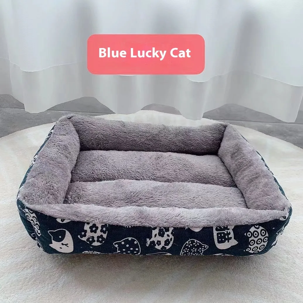 Moisture-proof linen dog bed in blue whale colour, rectangular shape with pillow, on floor.