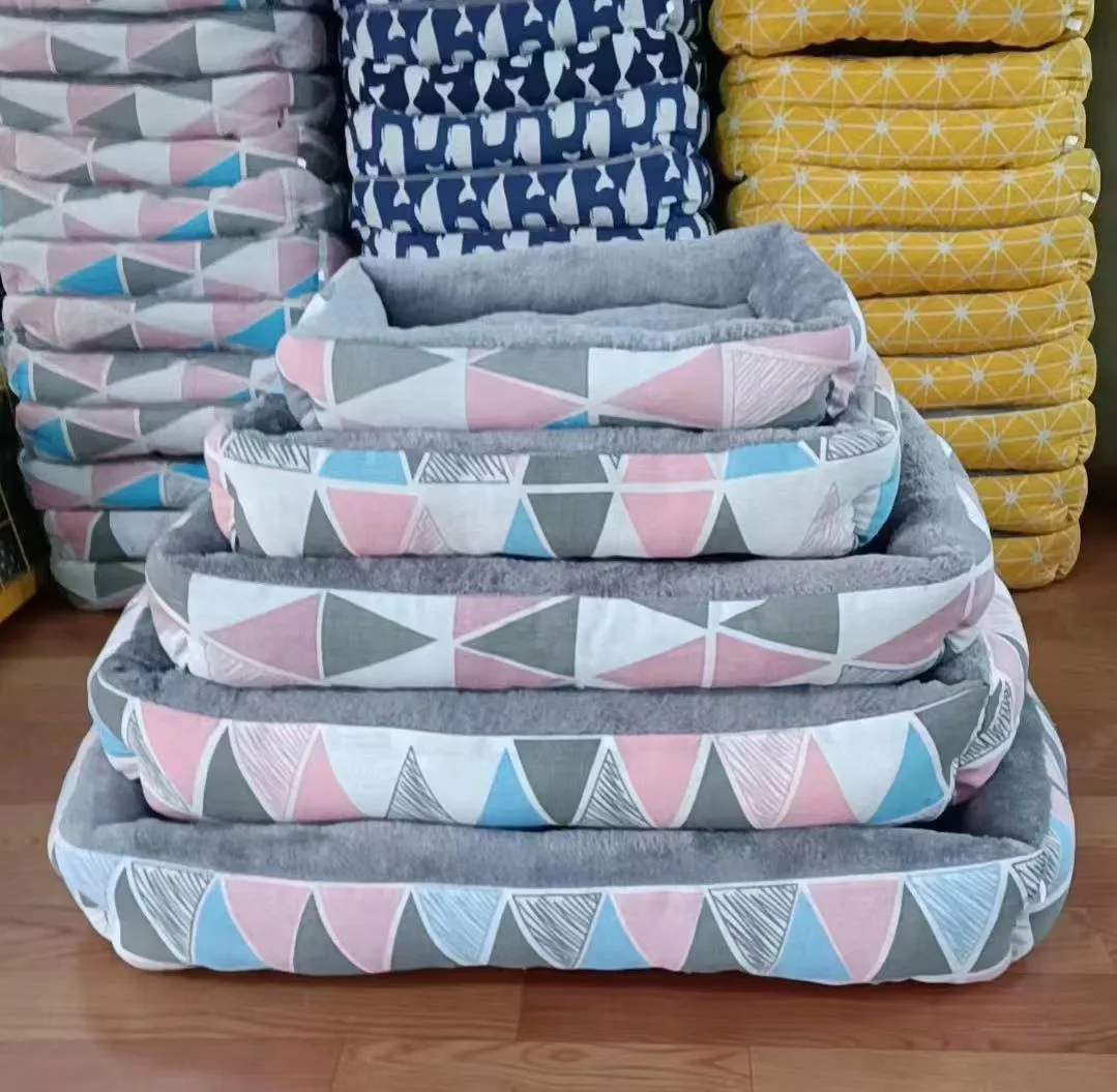 Moisture-proof linen dog bed in blue whale colour, rectangular shape with pillow, on floor.