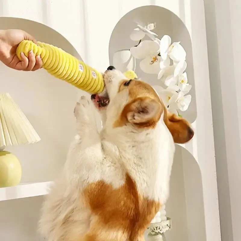 Yellow palm-shaped plush dog teething toy with squeaker for puppies