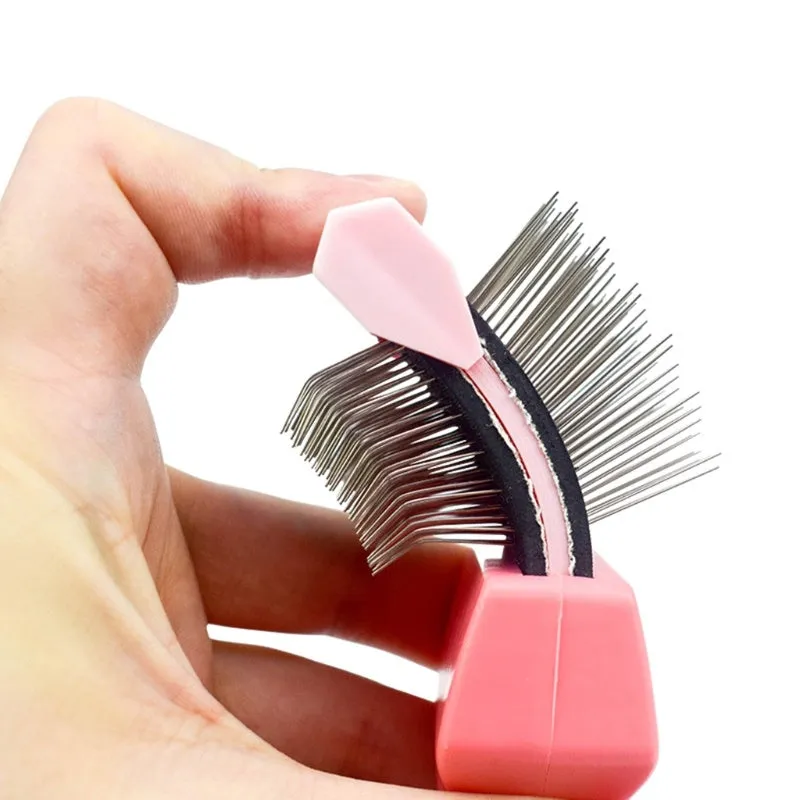 Double-sided pet brush with stainless steel pins showing blue colour and ergonomic handle