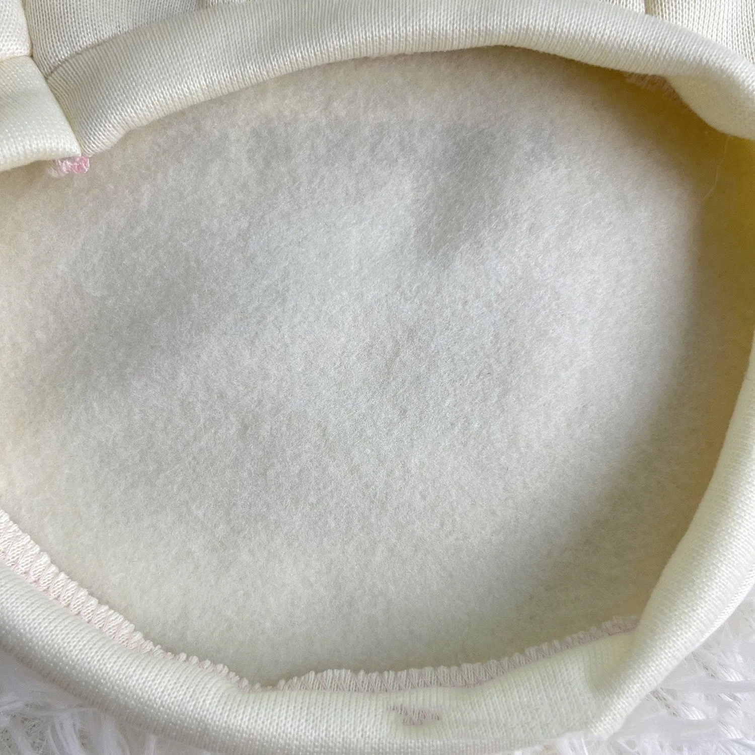 Korean cartoon plush dog clothes in beige with hood, polyester, side view on a dog