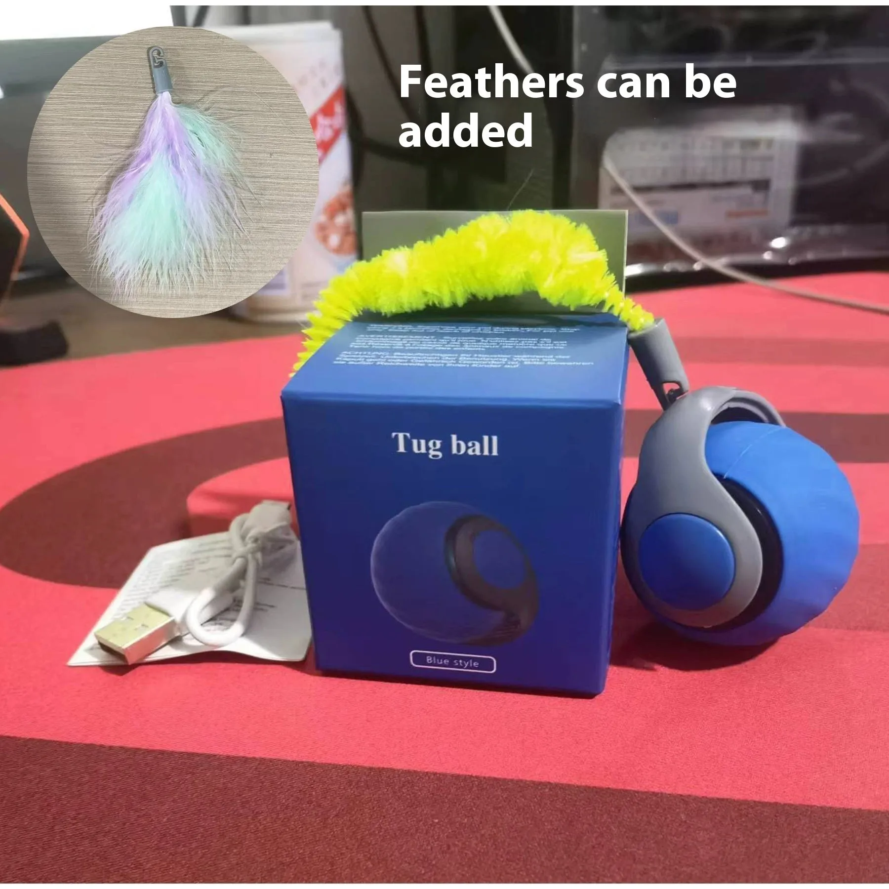 Automatic cat toy car with silicone spike ball in blue rolling on wooden floor