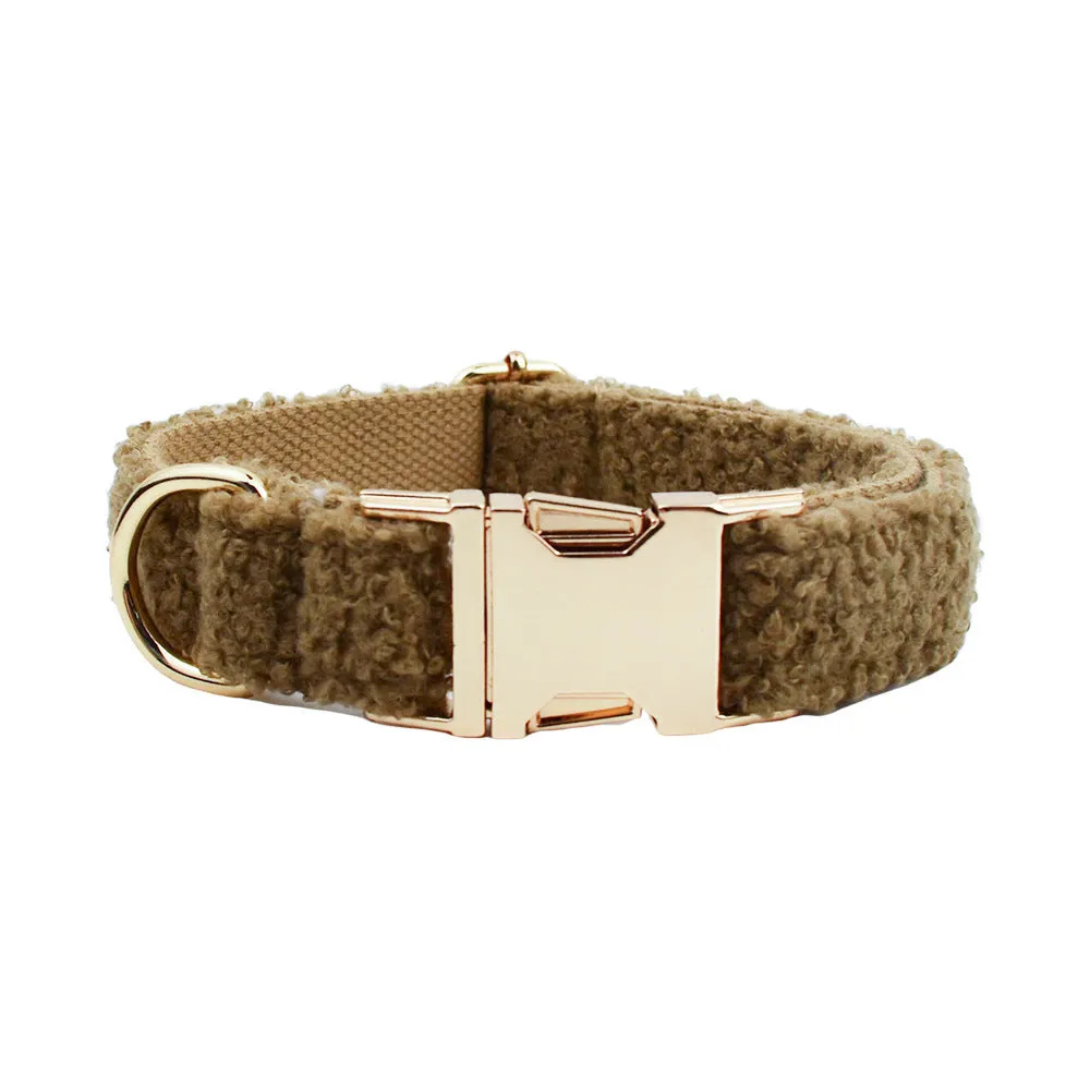Brown polyester dog necklet set with collar, leash, bow, and vest on a hand-holding rope