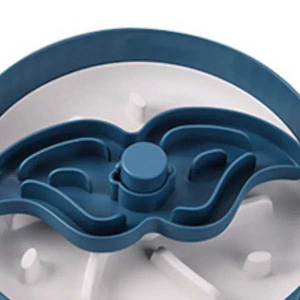 A rotating plastic pet feeding game board with an anti-choke pad and a detachable silicone licking mat in a windmill pattern.