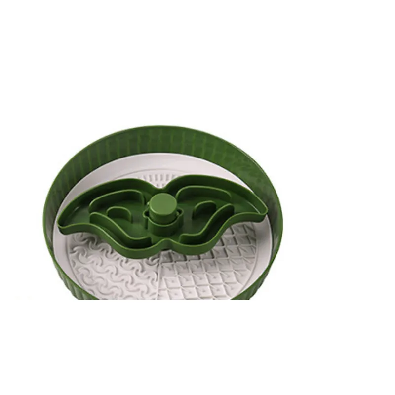 A rotating plastic pet feeding game board with an anti-choke pad and a detachable silicone licking mat in a windmill pattern.