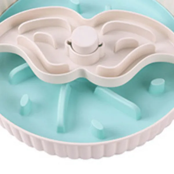 A rotating plastic pet feeding game board with an anti-choke pad and a detachable silicone licking mat in a windmill pattern.