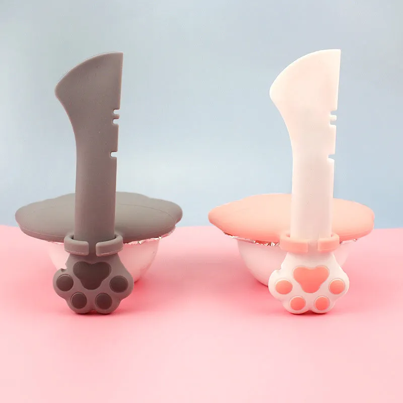 Multifunction silicone pet food spoon and can opener with pink lid, 5.1 inches long, paw-shaped scoop, white background