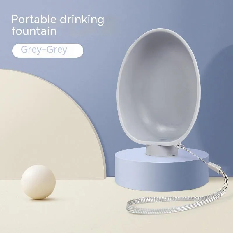 Portable dog drinking bowl in blue, 125x95x40mm, ABS material, slow-flow valve for outdoor dog feeding