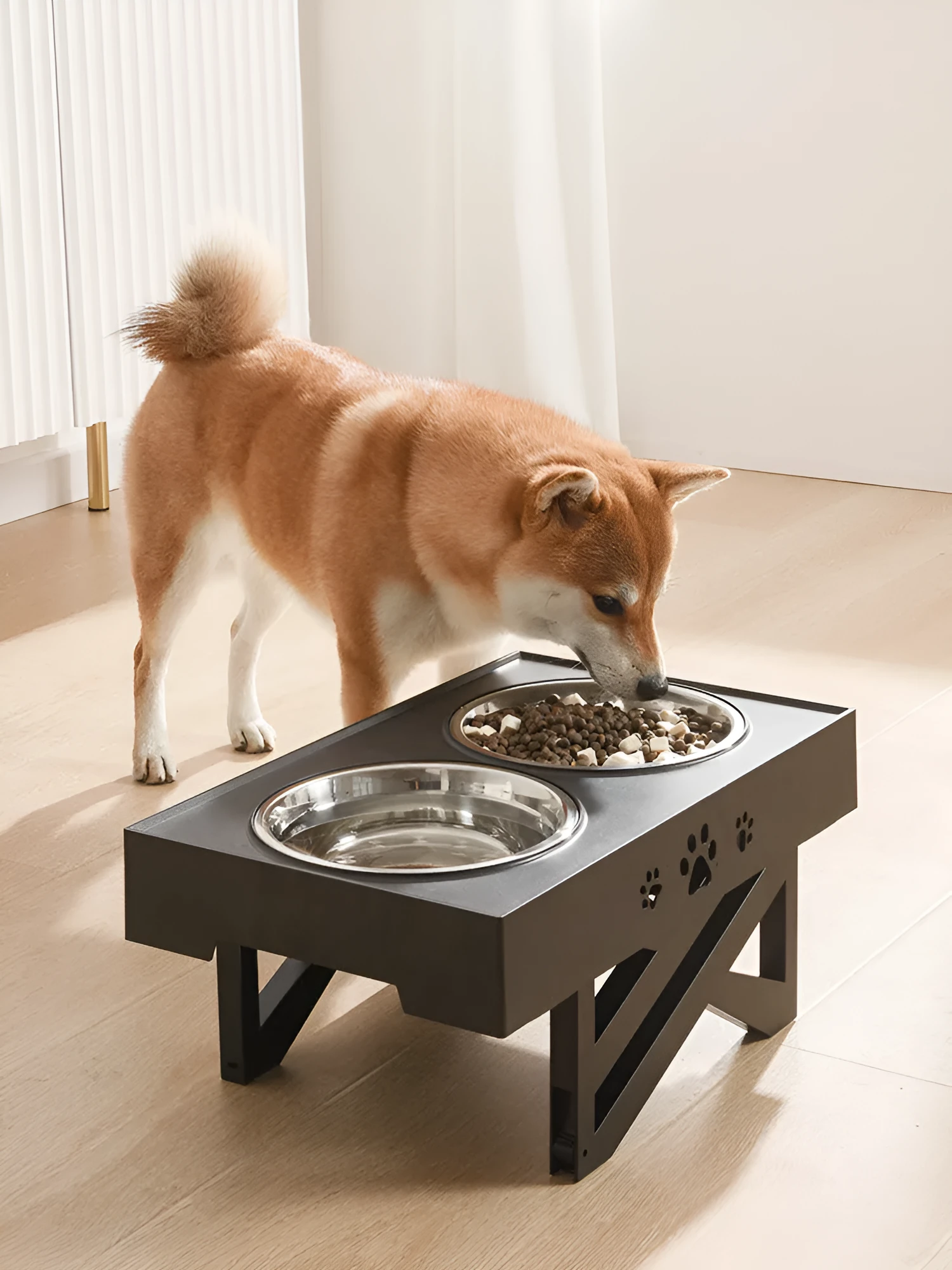 Black folding pet bowl made of plastic and stainless steel for dogs, collapsed for storage