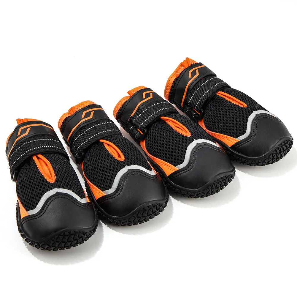 Pair of summer breathable pet dog shoes with non-slip rubber sole in gray black colour on outdoor surface