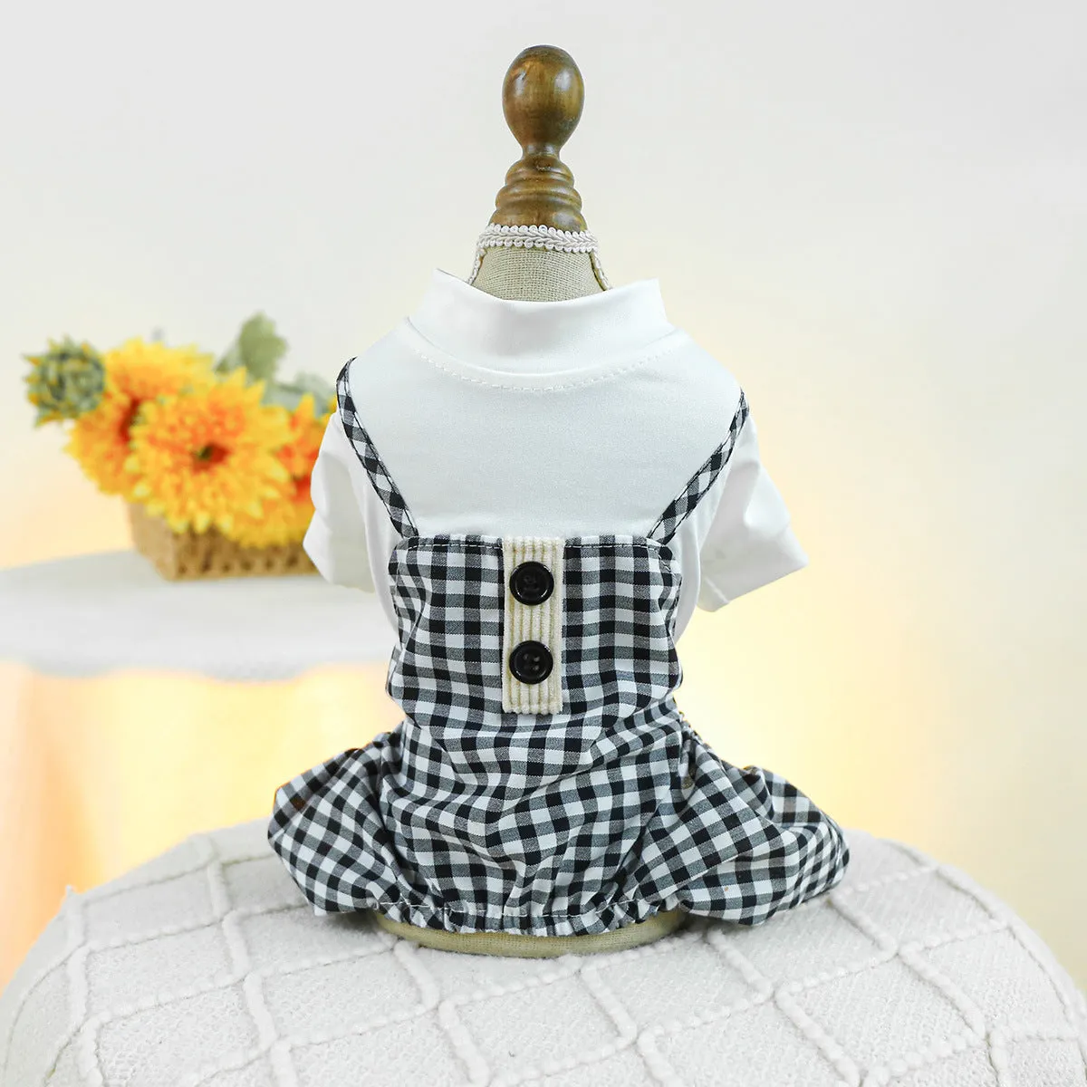 Fashion pet dog plaid overalls in black and white suspender style on a dog, polyester material