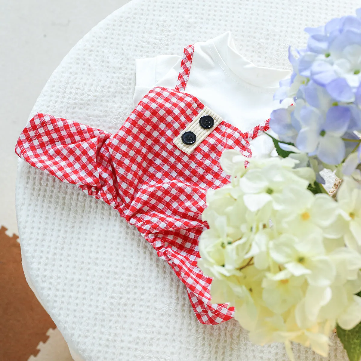 Fashion pet dog plaid overalls in black and white suspender style on a dog, polyester material