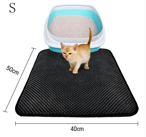 Double layer EVA cat litter mat in black with textured surface, placed under a litter box to trap debris