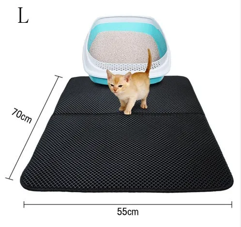 Double layer EVA cat litter mat in black with textured surface, placed under a litter box to trap debris