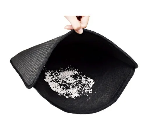 Double layer EVA cat litter mat in black with textured surface, placed under a litter box to trap debris