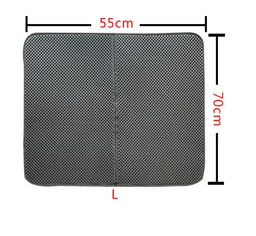 Double layer EVA cat litter mat in black with textured surface, placed under a litter box to trap debris