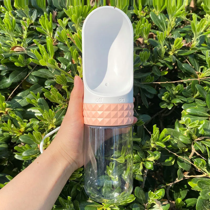 Portable dog water cup with one-click lock, food-grade ABS construction, available in various colours for outdoor pet hydration